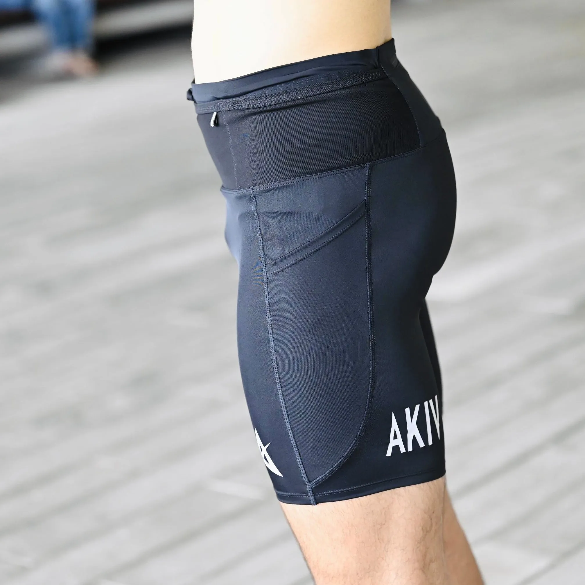 AKIV 2-in-1 Multi-Pocket Pro Tights Unisex | For Road Running